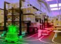 AI system learns to maintain warehouse robotic site visitors operating easily | MIT Information